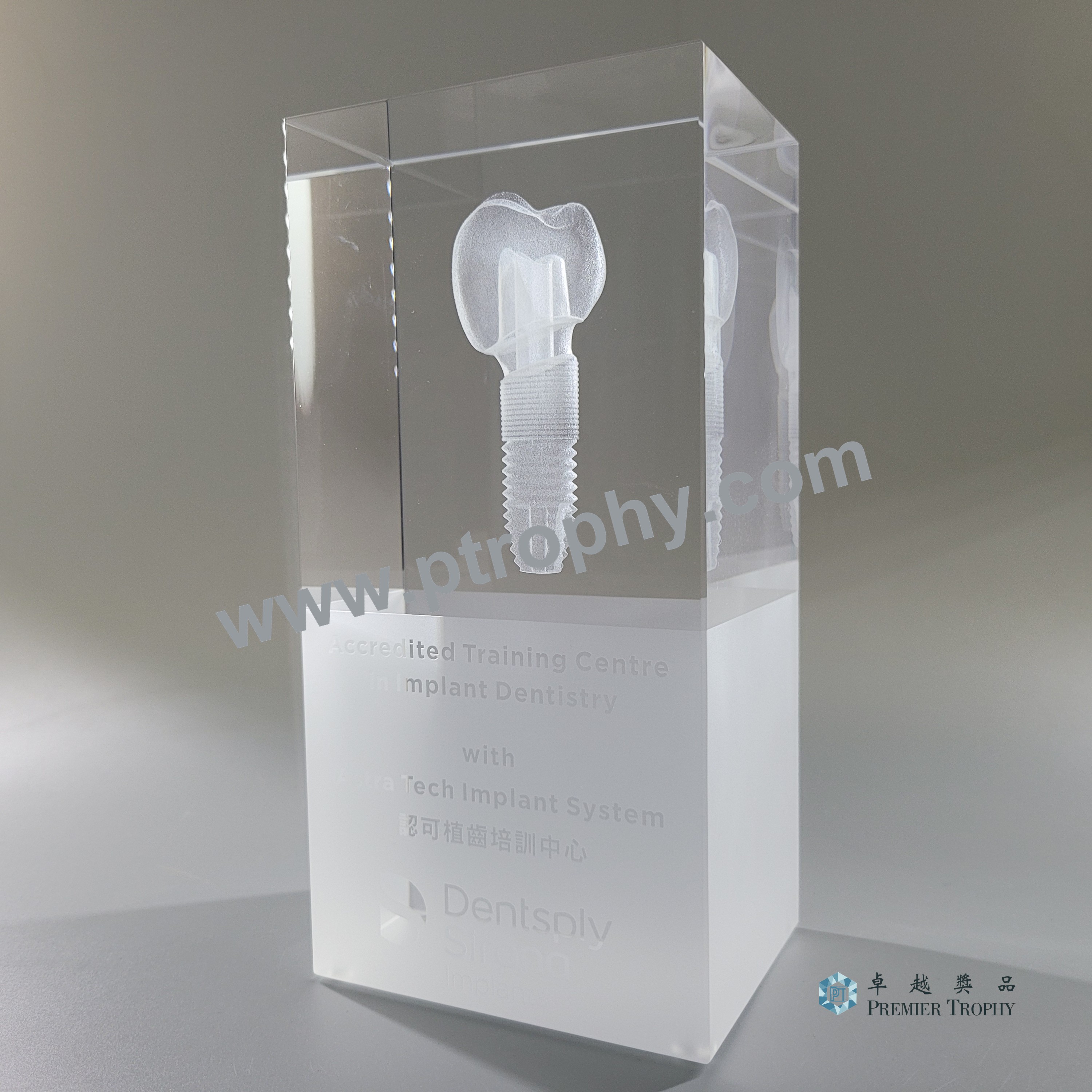 Crystal plaque with a three dimensional laser engraved implant, made for a medical accreditation