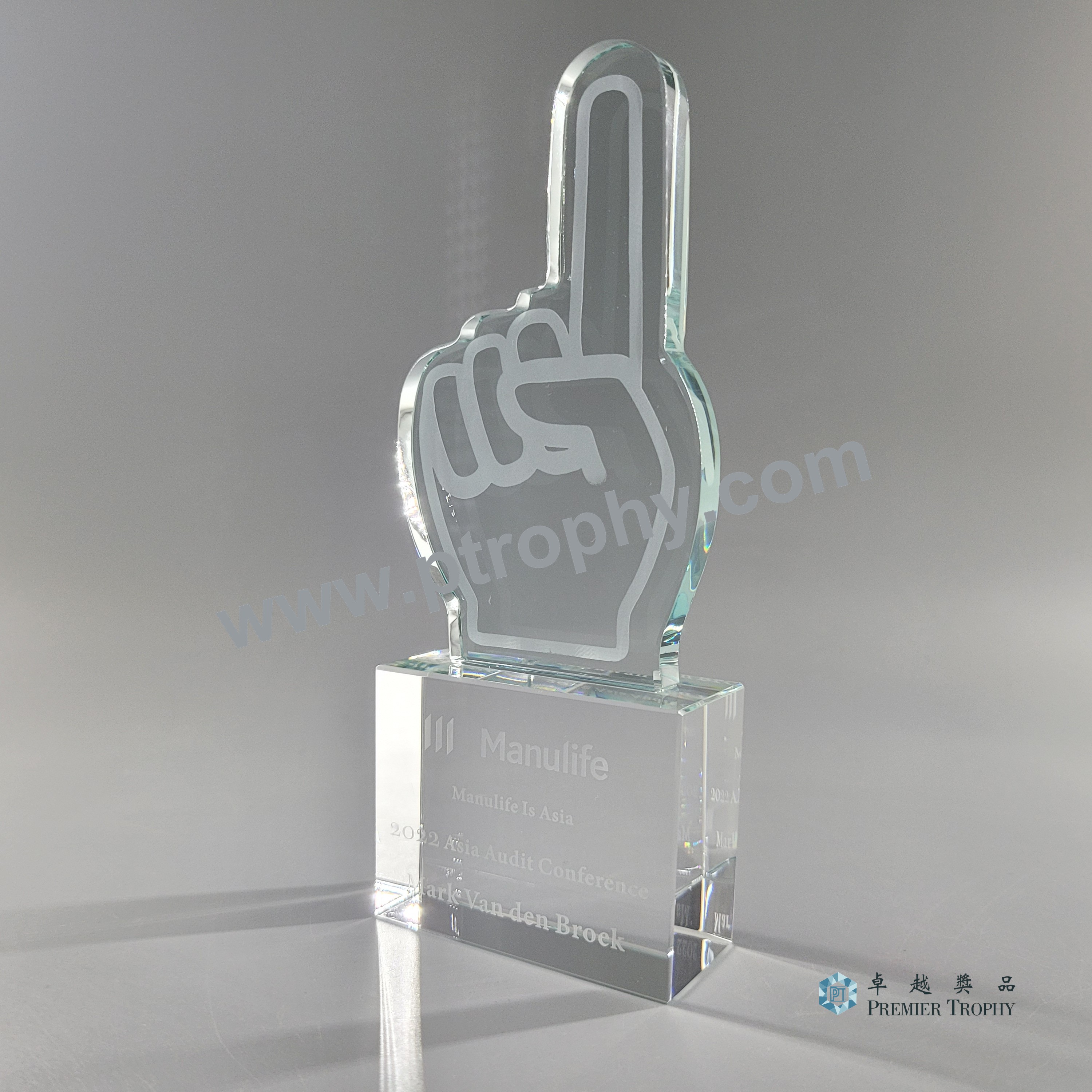 Tall optical crystal award engraved for an insurance group conference in Hong Kong